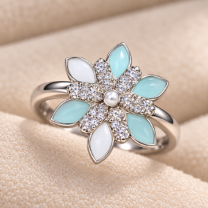 Close-up of Mint Blossom 925 Silver Ring showcasing mint and white floral petals, sparkling stone detailing, and pearl-like centre