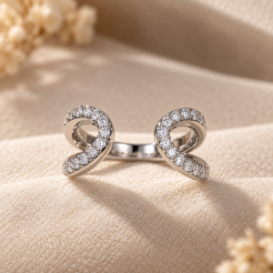 Close-up detail of the Mirrored Curve Pavé Ring showcasing its two open mirrored curves and intricate pavé-set sparkling stones.