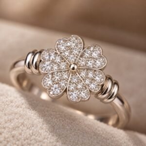 Close-up macro view of Silver Floral Ring showing intricate pavé flower petals, centre detail and side coil accents